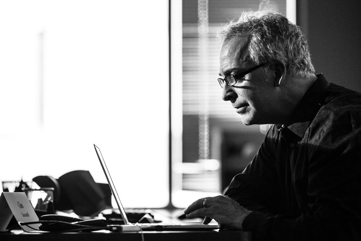 Gino typing on laptop